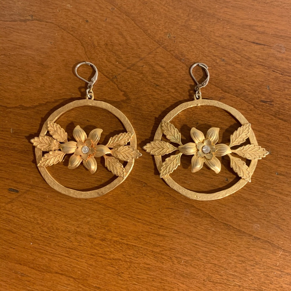 Bold gold hoop earrings with flowers